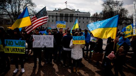 People take part in a pro-Ukraine rally in front of the White House to protest the Russian invasion of Ukraine on February 26 in Washington, DC. 