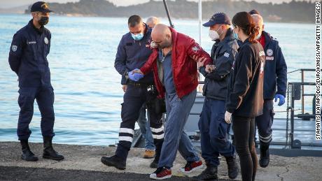 A rescued passenger arrived at the port of Corfu on Friday, after hundreds of people were evacuated from the ship.