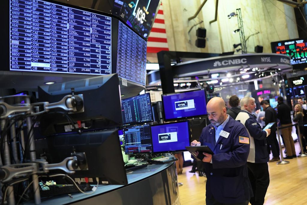 Stock futures drop amid COVID restrictions in China, packed earnings week