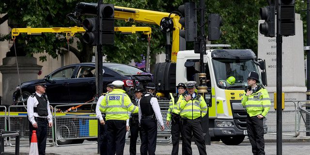 A police car removes a car after a security incident near Trafalgar Square, as Queen Elizabeth's platinum jubilee celebrations continue, in London, June 4, 2022.