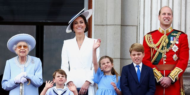 Queen Elizabeth, Prince William and Catherine, Duchess of Cambridge, appear alongside Princess Charlotte, Prince George and Prince Louis on the balcony of Buckingham Palace as part of the Trooping the Color procession during the Queen's Platinum Jubilee celebrations in London, Britain, June 2, 2022.
