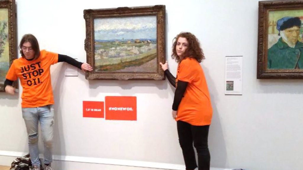 Climate activists in the UK sticking their hands on a Vincent van Gogh painting at the Museum of London