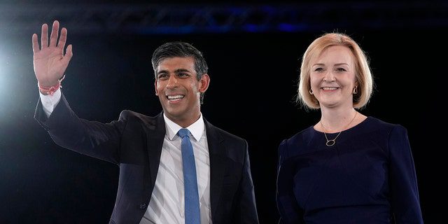 FILE - Liz Truss, right, and Rishi Sunak on the podium after election events for the Conservative Party leadership at Wembley Arena in London, Wednesday, August 31, 2022. After weeks of waiting, Britain will finally learn who its new prime minister will be.  The ruling Conservative Party will announce on Monday 5 September 2022 whether Foreign Secretary Liz Truss or former Chancellor of the Exchequer Rishi Sunak have won the largest number of party votes to succeed Boris Johnson as party leader and British Prime Minister. 