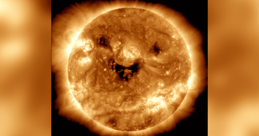 NASA snapped a photo of a giant space pumpkin.  This is the science behind the "smiling" sun.