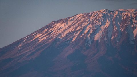 Snow-capped Mount Kilimanjaro at sunrise in 2021. UNESCO reports that the glaciers in the World Heritage Site shed about 58 billion tons of ice each year.