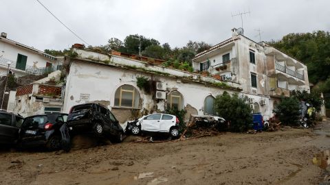 Damaged cars lying in the street after the landslide on Saturday.